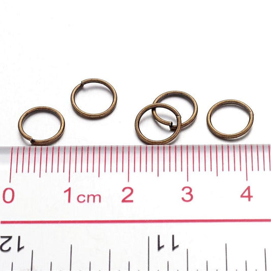 J298 - 100 pcs Antique Bronze Open Jump Rings - 8mm - 21 Gauge (0.7mm Thick)