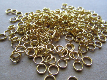 J064 - 100 pcs Double Rings - Gold Plated Open Jump Split Rings - 5mm - 22 Gauge