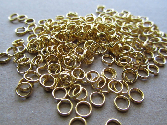 J064 - 100 pcs Double Rings - Gold Plated Open Jump Split Rings - 5mm - 22 Gauge