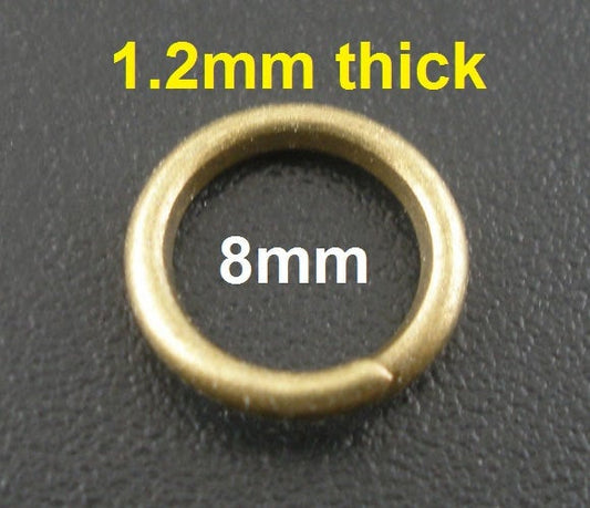 J137A - 100 pcs Antique Bronze Open Jump Rings - 8mm - 16 Gauge (1.2mm Thick)